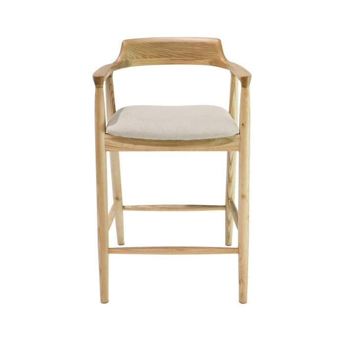 Wooden bar stool with a white cushion on a white background