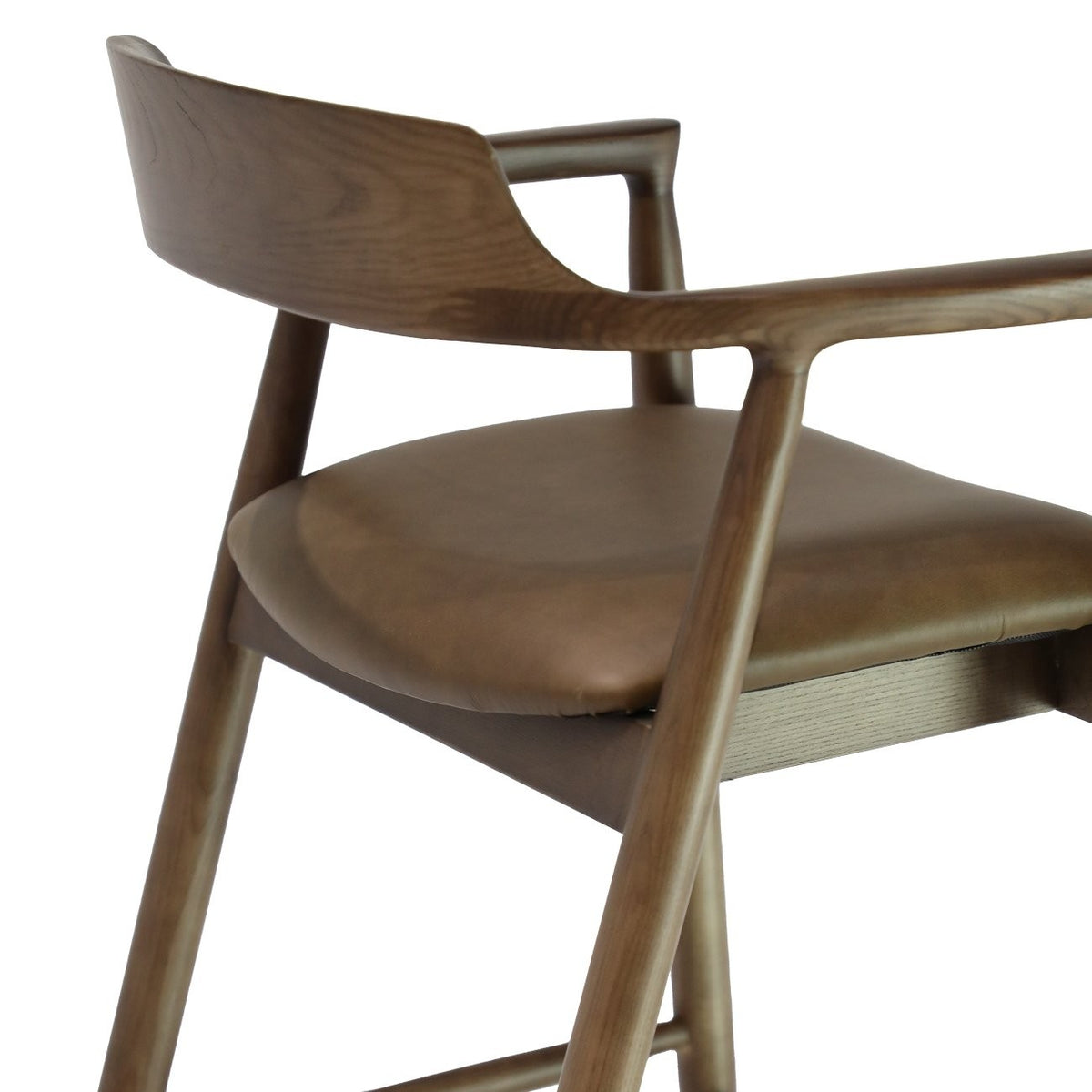Wooden chair with brown leather seat on a white background