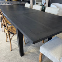 Dining table with chairs in a room setting