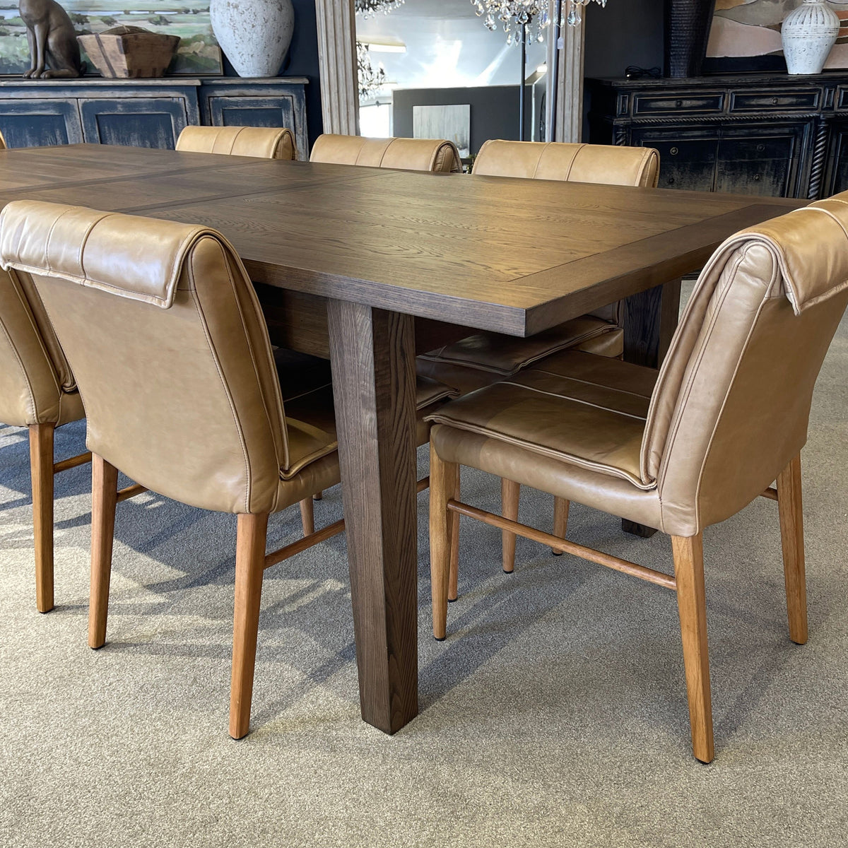 Dining table with brown chairs in a room setting