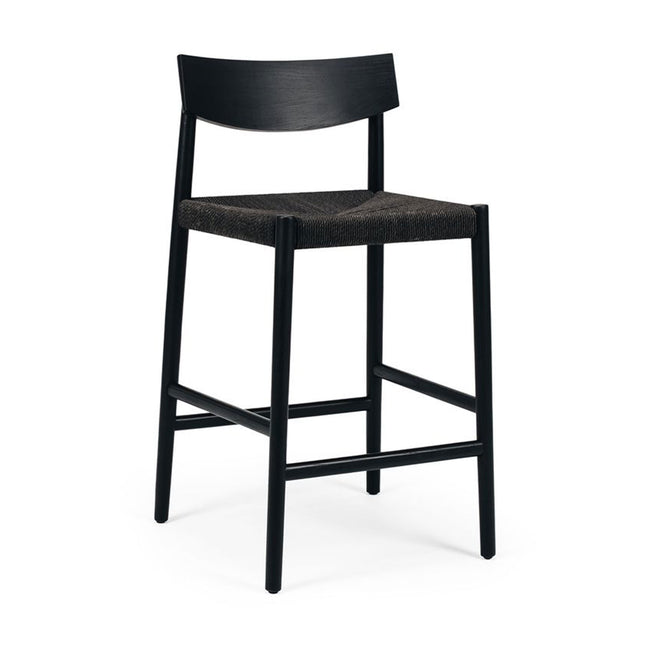Black bar stool with woven seat on a white background