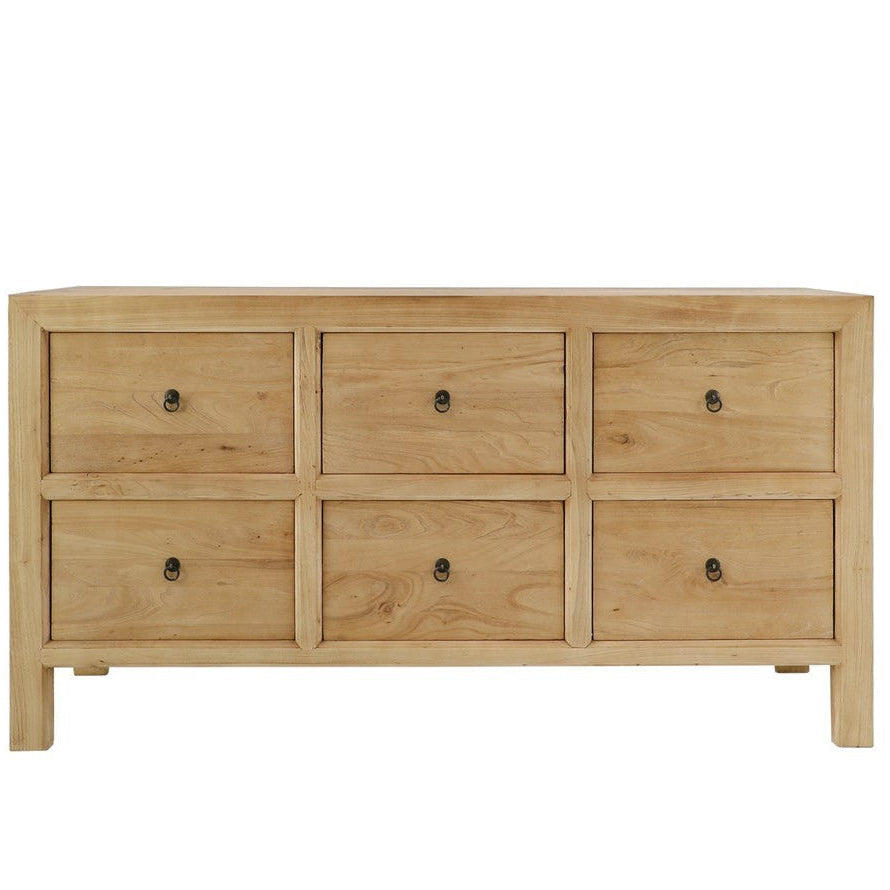 Wooden dresser with four drawers on a white background
